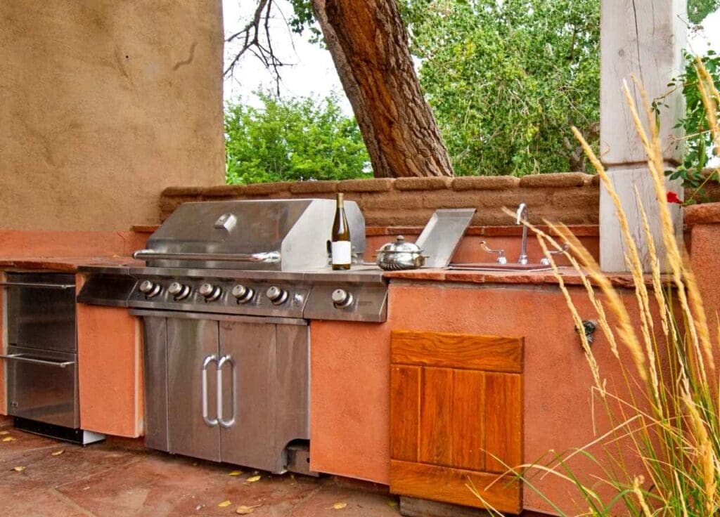 Stainless Steel vs Stone Outdoor Kitchens